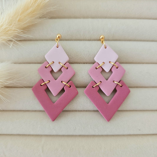 Pink geometric earrings with gold accents