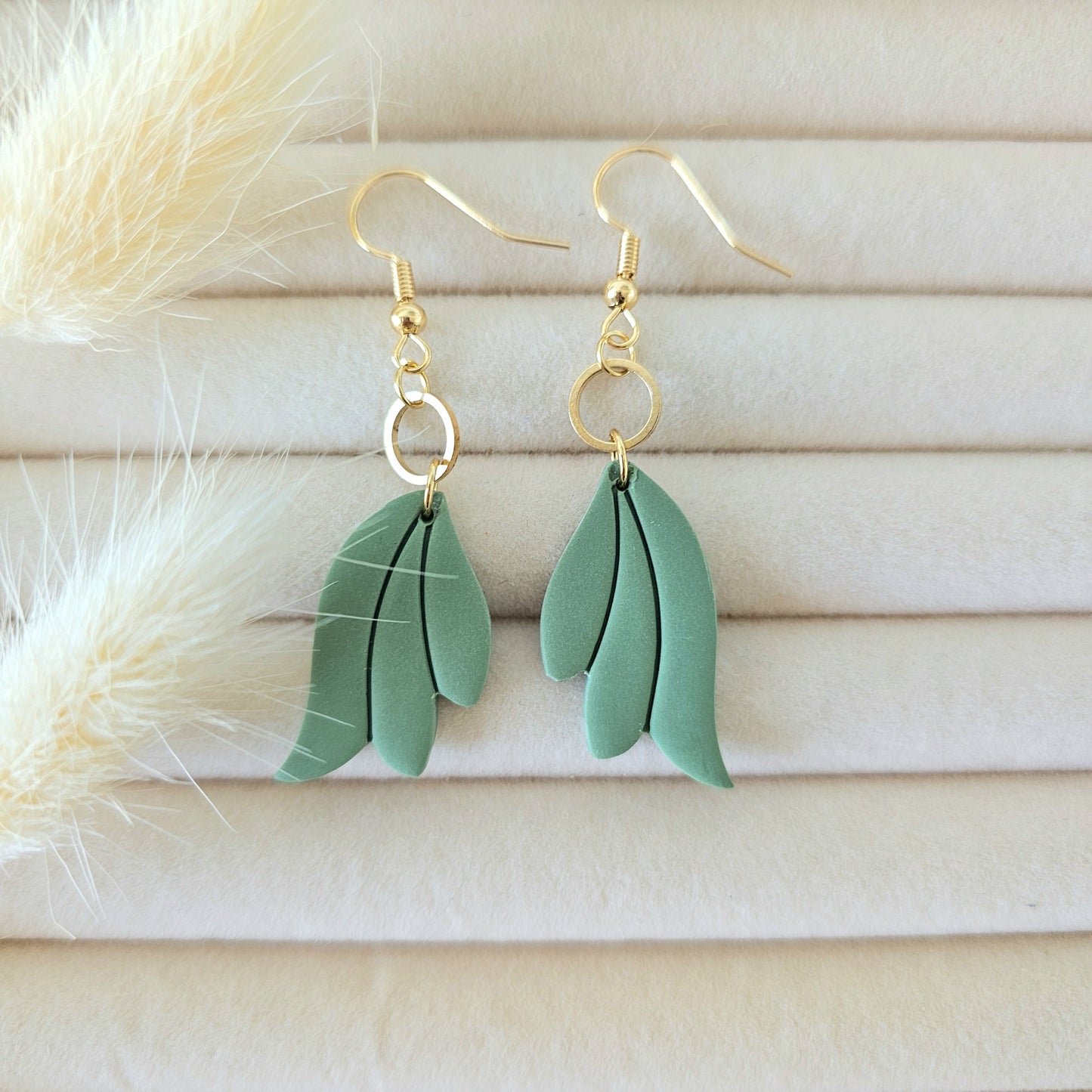 Green leaf-shaped earrings