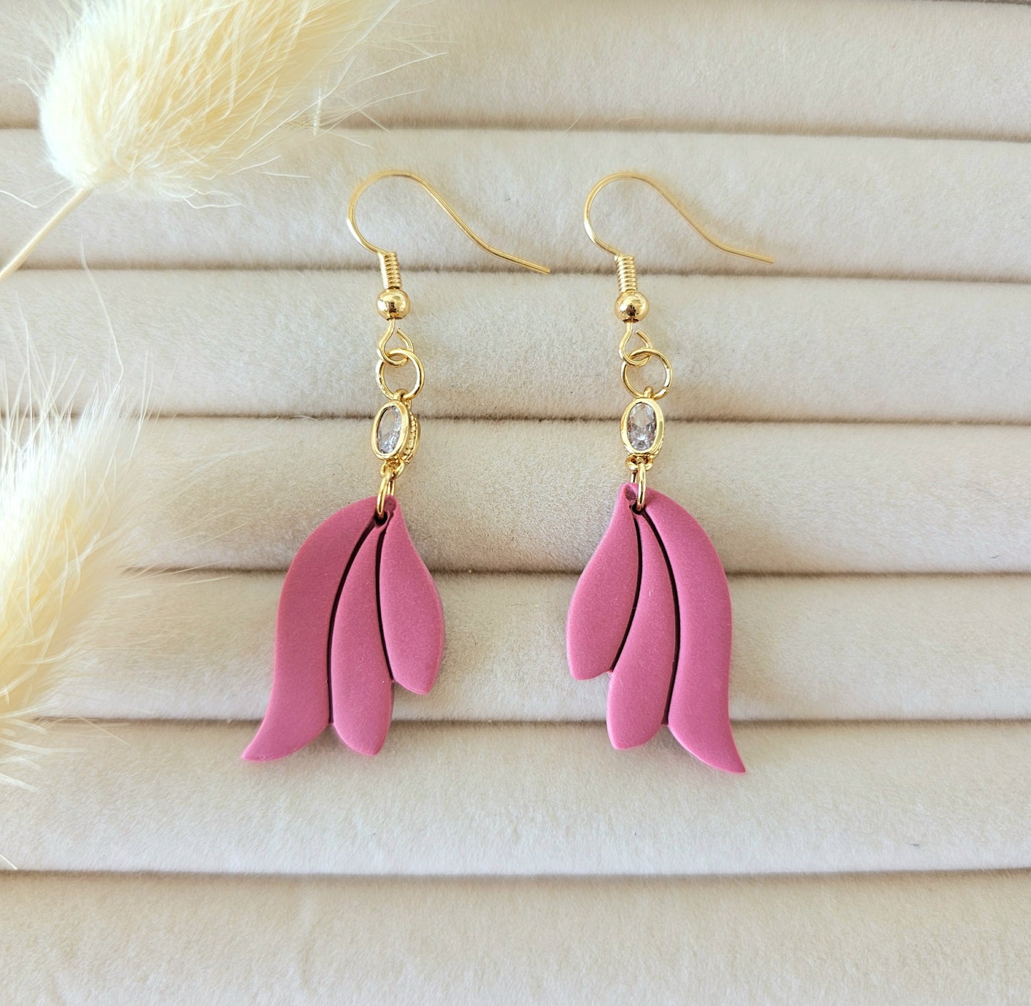 Pink leaf-shaped earrings with gold hooks