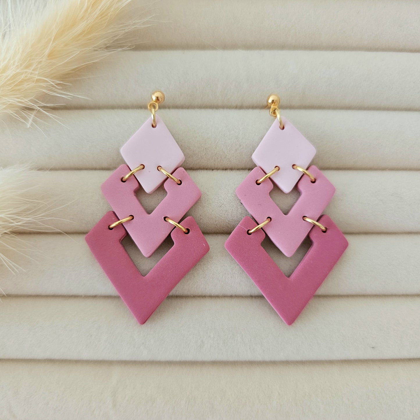 Pink geometric earrings with gold accents